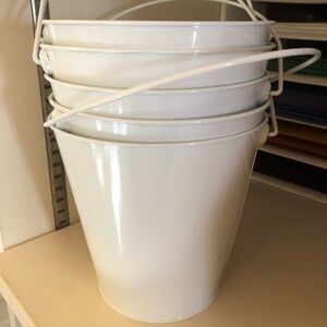 5 white tins